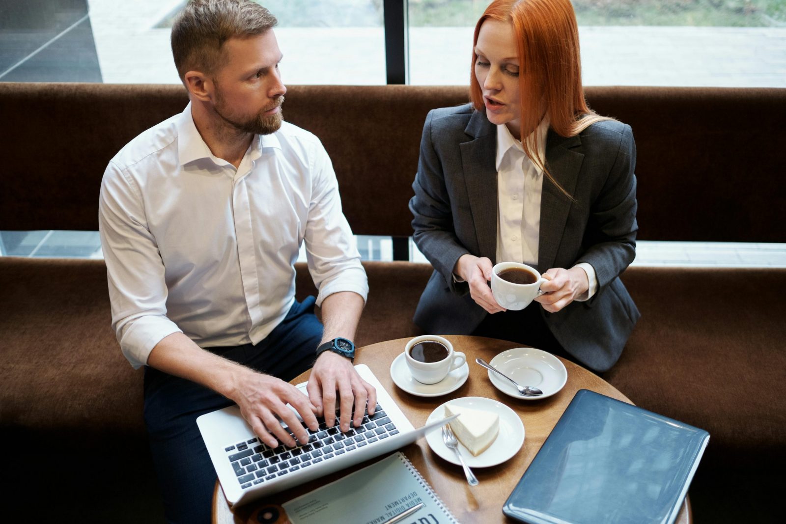 Two professionals having a calm conversation — illustrating how to set boundaries with colleagues at work.